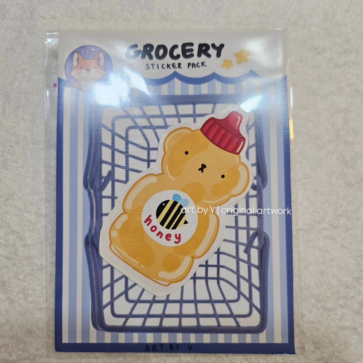 Honey bottle sticker in grocery-themed packaging