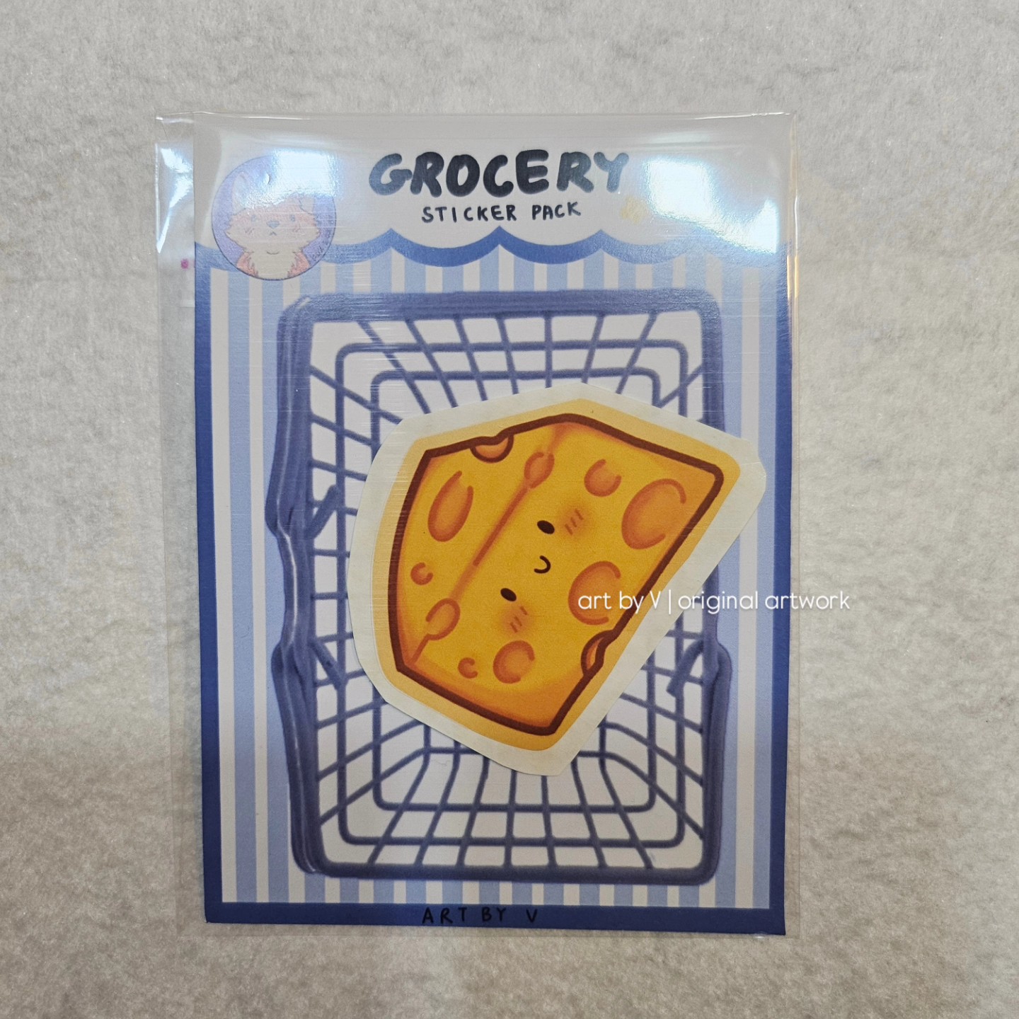 Cheese wedge sticker in grocery-themed packaging