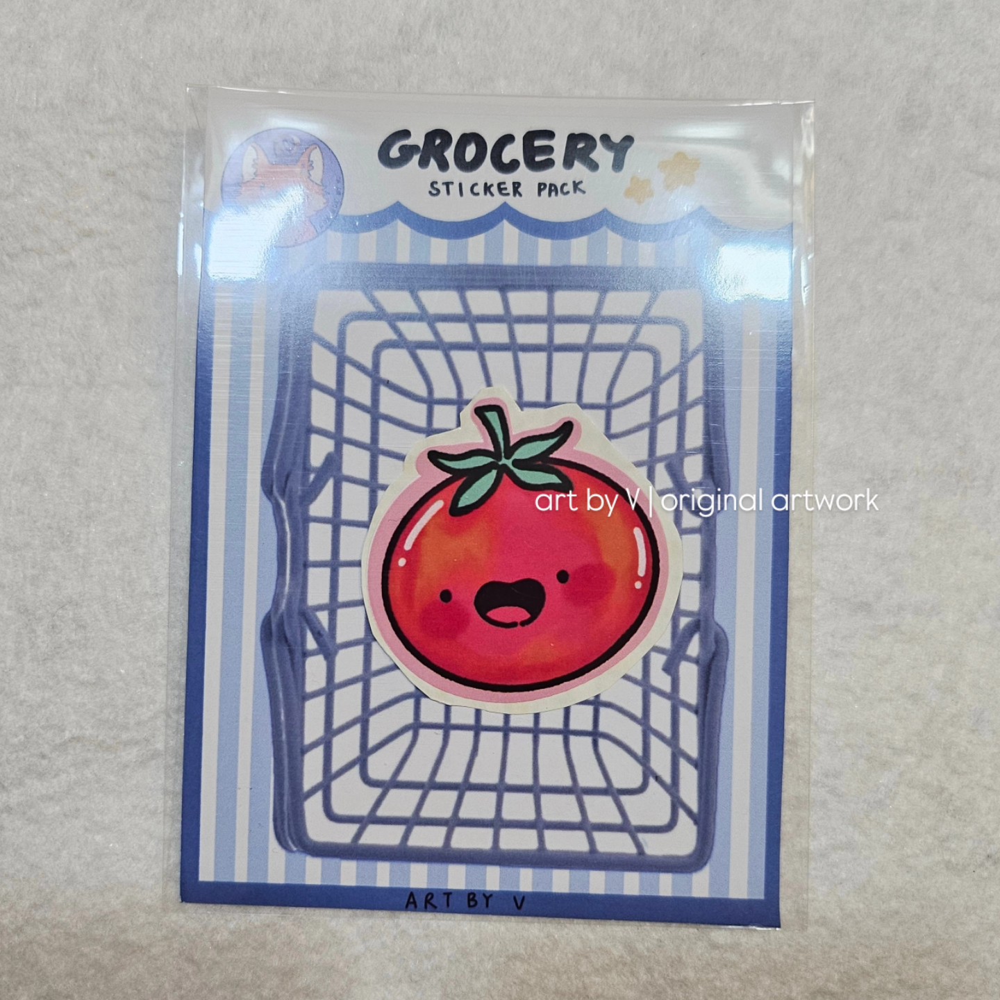 Tomato sticker in grocery-themed packaging