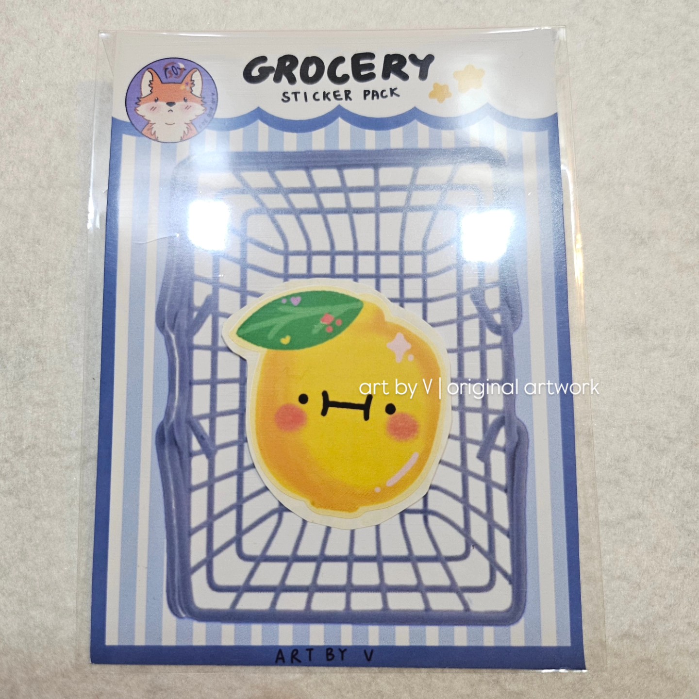 Lemon sticker in grocery-themed packaging